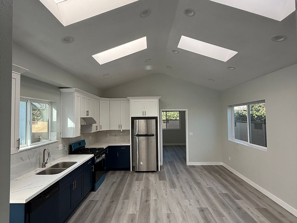 Living room/kitchen with skylights