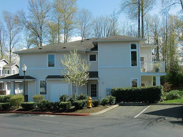 Ground floor end unit with ample guest parking just steps away!