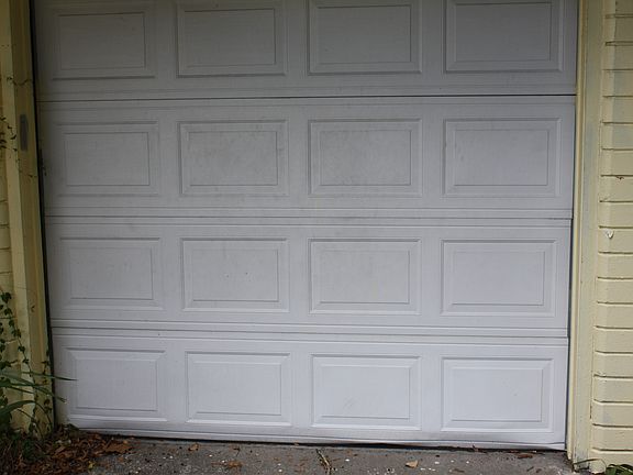 Includes a garage with laundry area