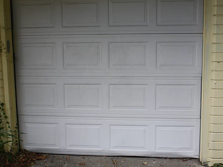 Includes a garage with laundry area