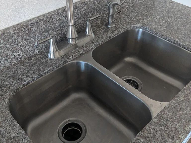Granite Countertops, new faucets, sink and garbage disposal