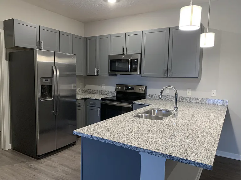 Our kitchens feature sleek appliances and plenty of cabinet space, making cooking and storage effortless.