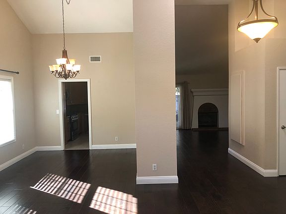 View from the front door; dining area at left leading into kitchen. You can just see the fireplace in the family room on the right.