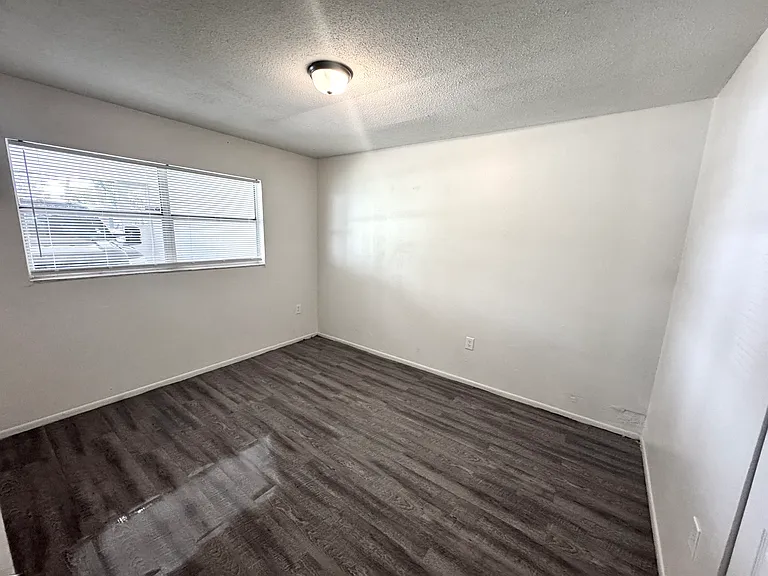 Interior photos are of a neighboring unit with identical floor plan. Paint color is the same, but the flooring is actually ceramic tile.