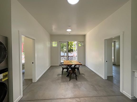 10 foot ceilings w/ recessed lighting & 
skylights in the entire space