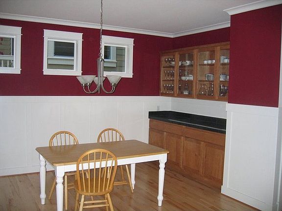 Dining Room w/ glass front cabinets and granite tile top