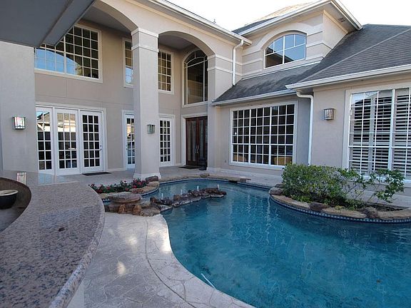 COURTYARD POOL WITH 5 FOOT WATERFALL