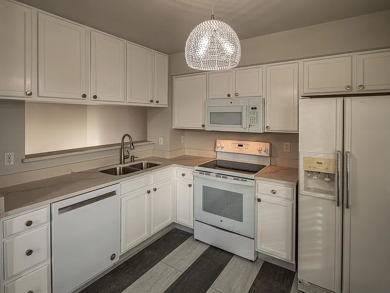 Kitchen with new quartz counter tops and new appliances
