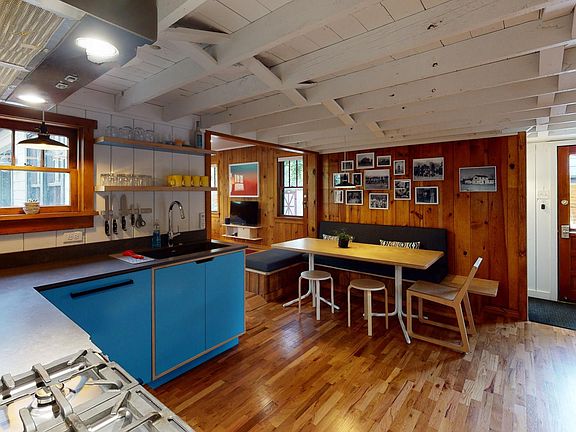 Fully stocked custom kitchen with modern appliances.