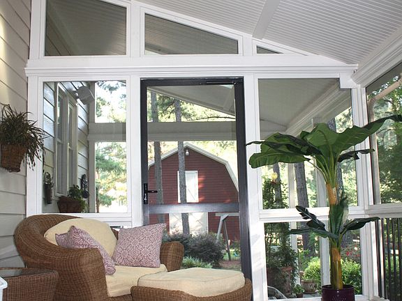 Screen porch overlooks picturesque barn