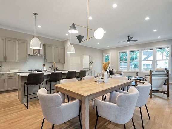Dining area looking into living & kitchen area