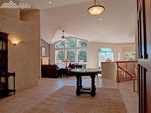 Entry with vaulted ceilings and open floor plan