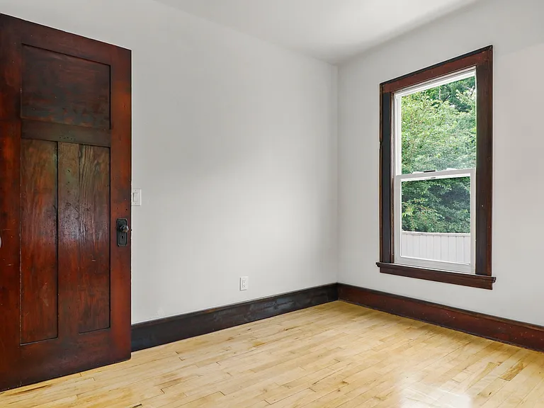 One of the bedrooms ... great looking hardwoods and new windows!