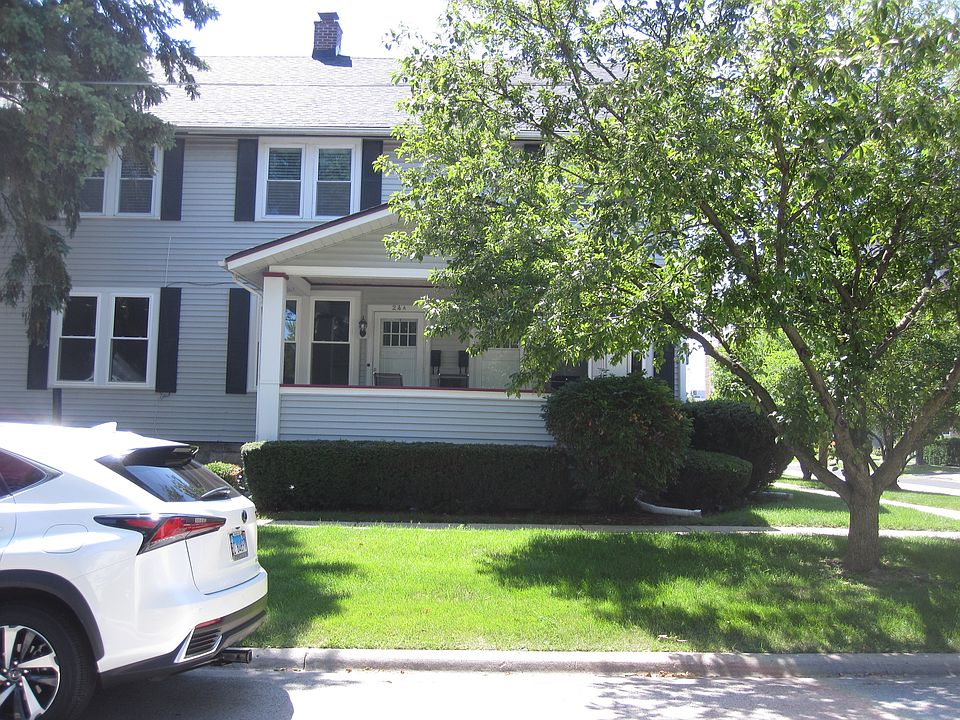 This is the front of the apt. on left side. also showing front porch. There is a concrete patio of back door by the Kitchen
