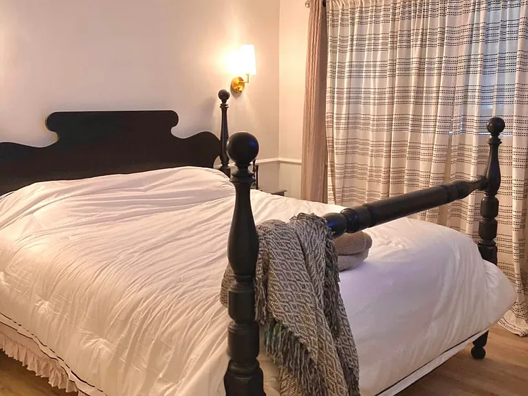 Spacious primary, with built-in reading lights for a calming welcome home experience.