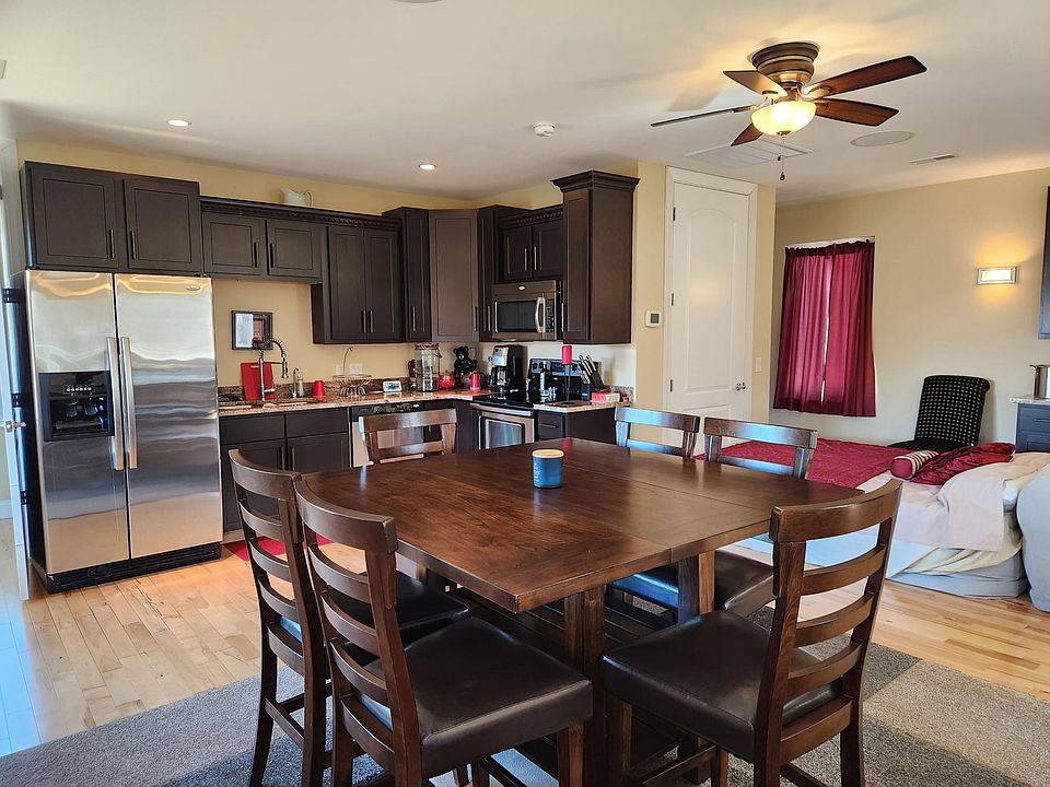 Full kitchen and dining area. Air bed available for guests visible here.