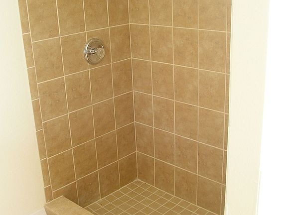 Fully tiled walk in shower in the master