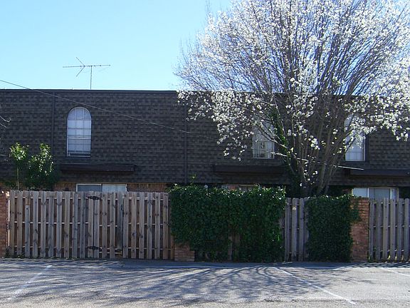 Private gate leads to parking from your back patio