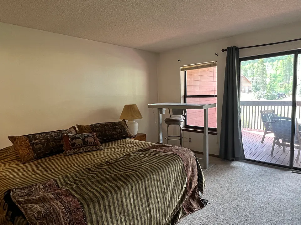 Master bedroom with access to deck.