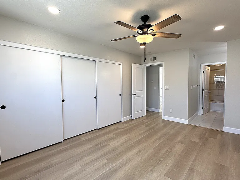 Primary bedroom with 13+ft of closet and entrance to primary bath