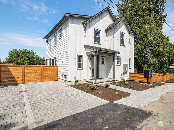Side elevation showing designated parking spot with EV charging.