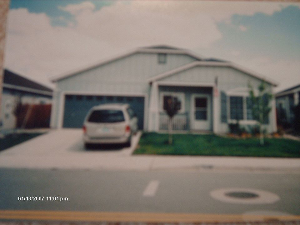 Front of Home with Flower Bed