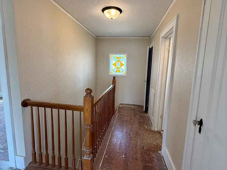 Hardwood floors are being refinished.