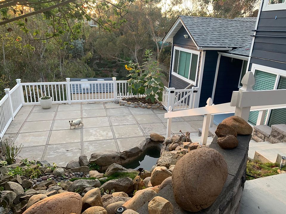 Entrance, private patio with waterfall and pond