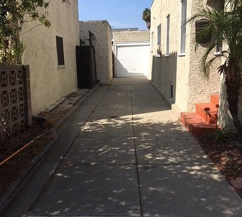 Long driveway with single card narrow garage.