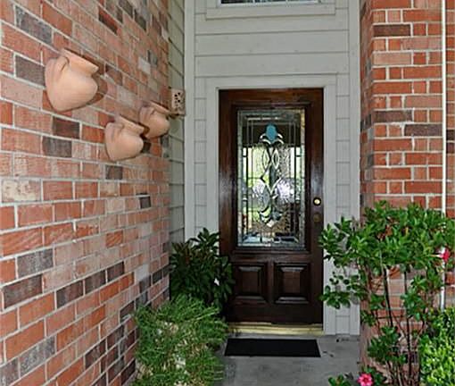 Beautiful shaded from porch welcomes you and guest home right inside the beveled glass front door.