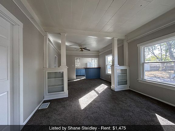 Shows living room, dining room and kitchen. Second bedroom is to the left of this photo.