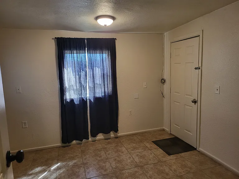Back Bedroom with its own exit or entrance door, and an outside gate exit or entrance to not disturb anyone. Could be used for a mother in law setup.
*There is a guest house/studio in back that will be available to rent seperately.