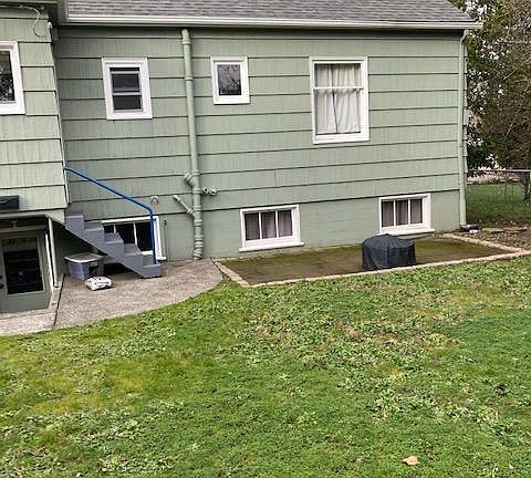 Partial backyard and small patio area