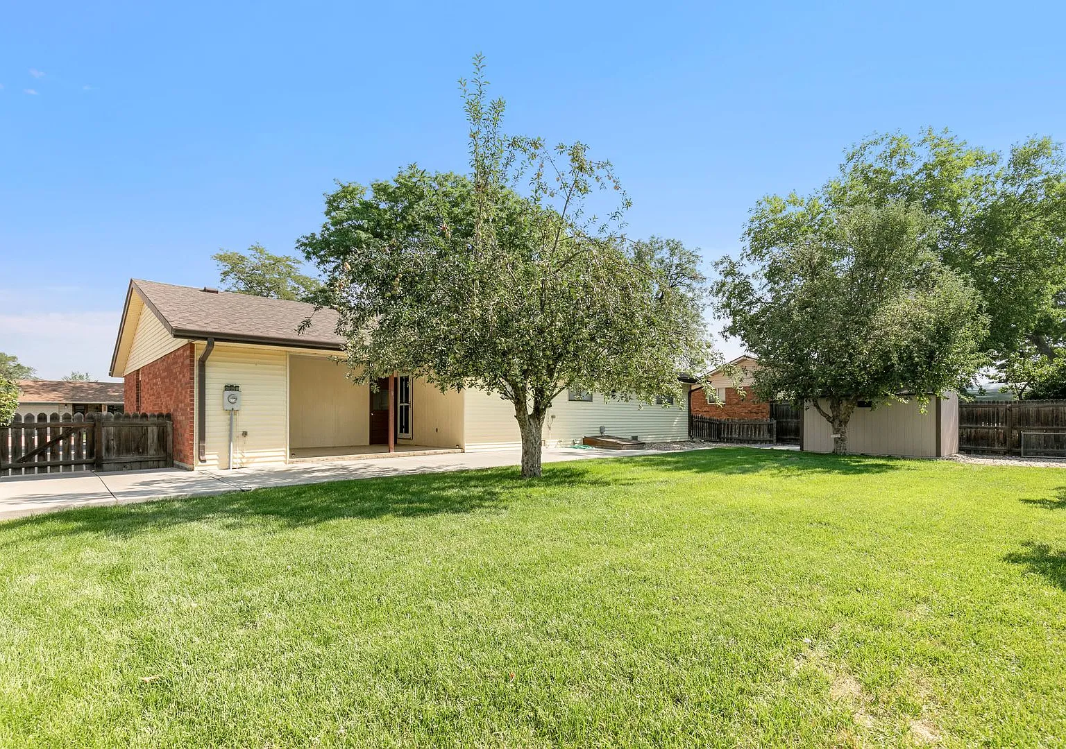 Charming 3 Bedroom Loveland Home | Yard Care Included — Photo 2