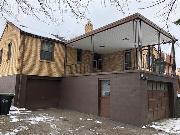 Two Garages & Large Covered Rear Porch