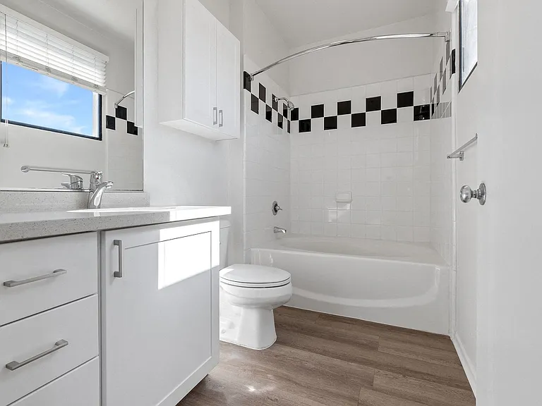 Luxury vinyl extends to the bathroom