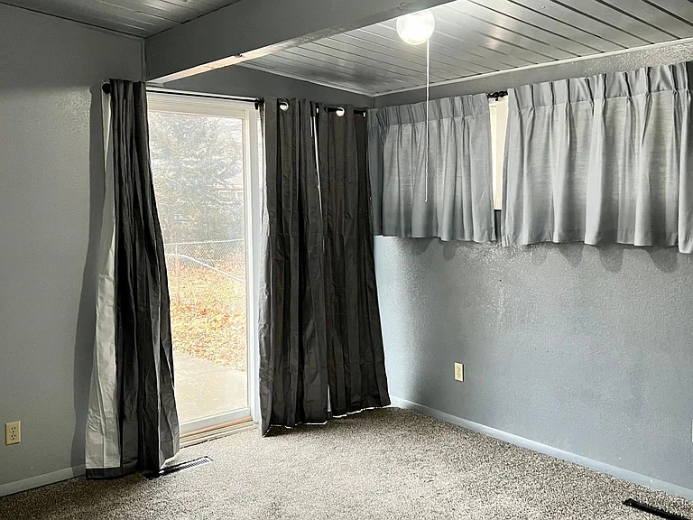 Bedroom with sliding door to patio; would also be a great office.