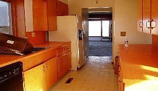 Kitchen, looking from nook down toward LR