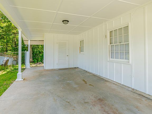 Covered carport with storage room