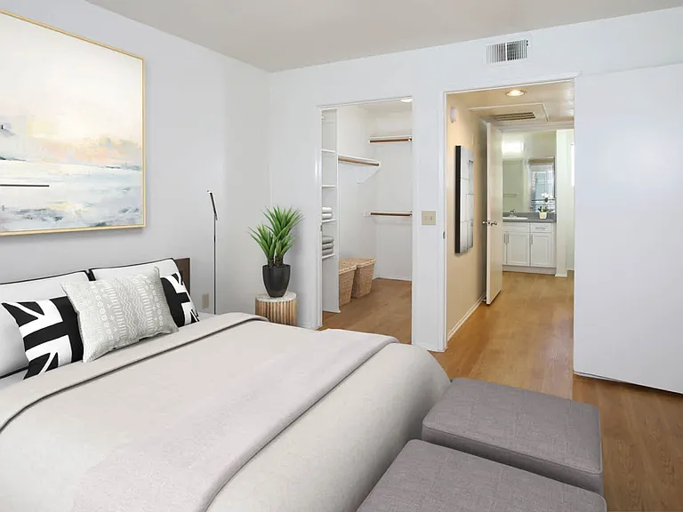 Bedroom with Hard Surface Flooring and Walk-In Closet