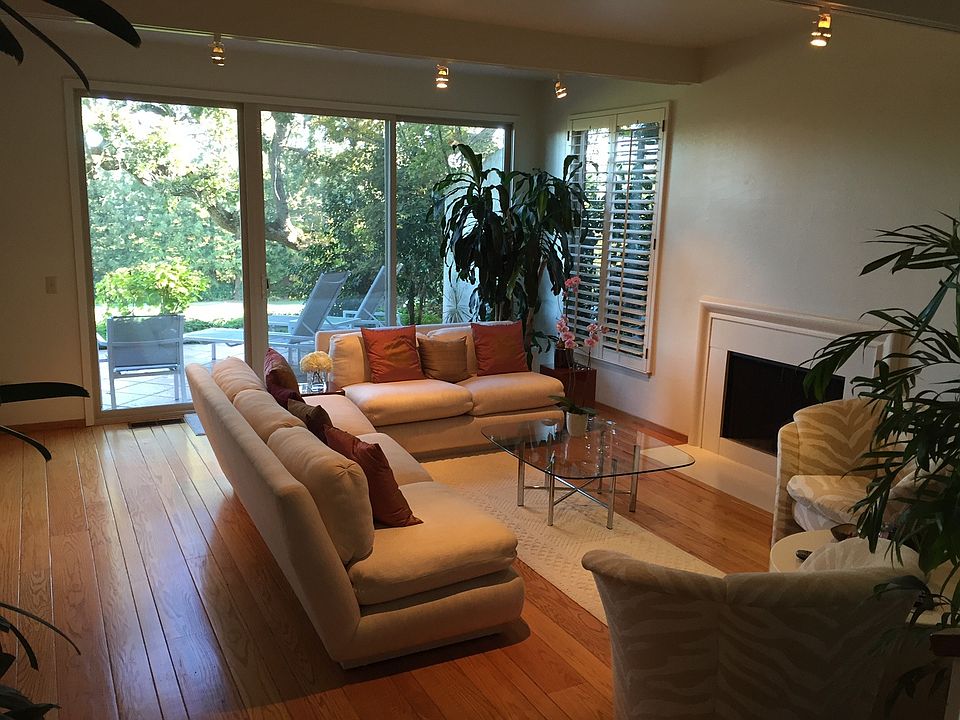 Living room with large patio overlooking golf course
