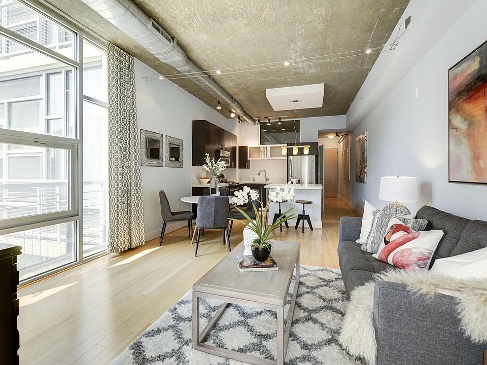 View from master bedroom into open concept living room and kitchen
