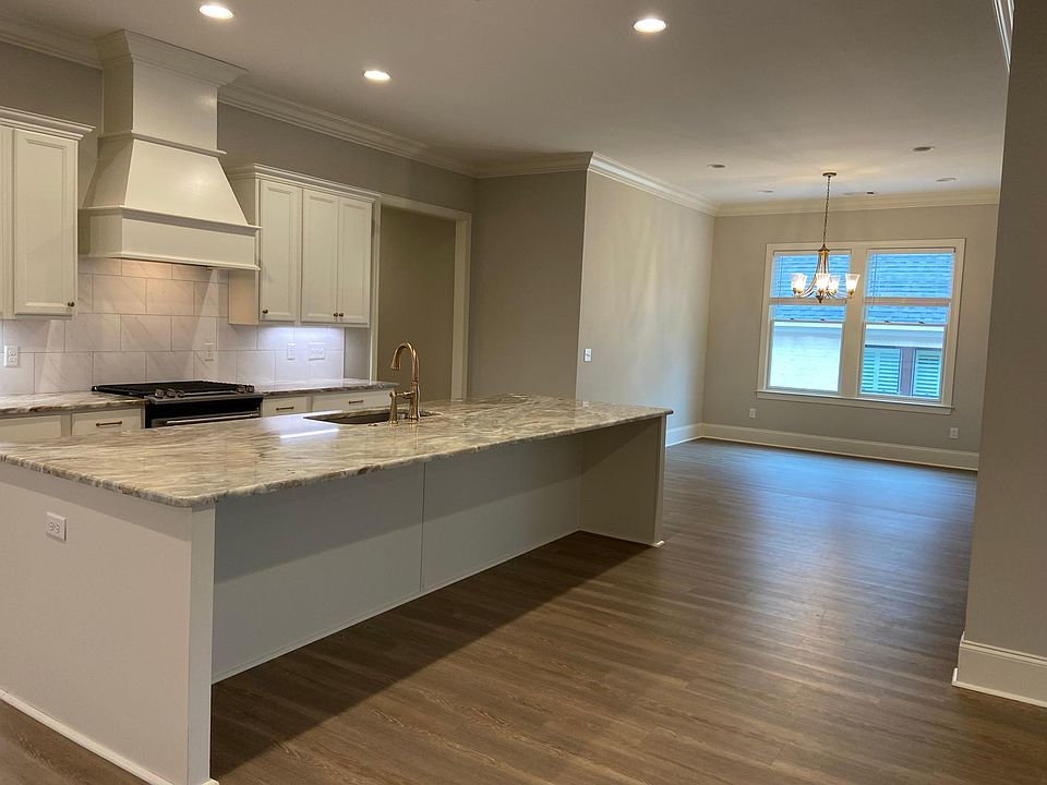 Granite countertops, breakfast area and bar seating