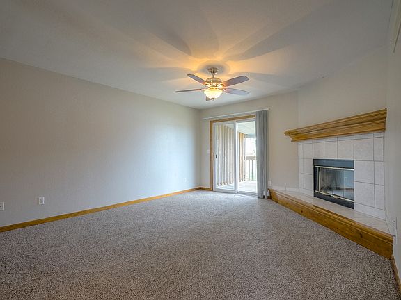 Living room with sliding patio door to covered deck
