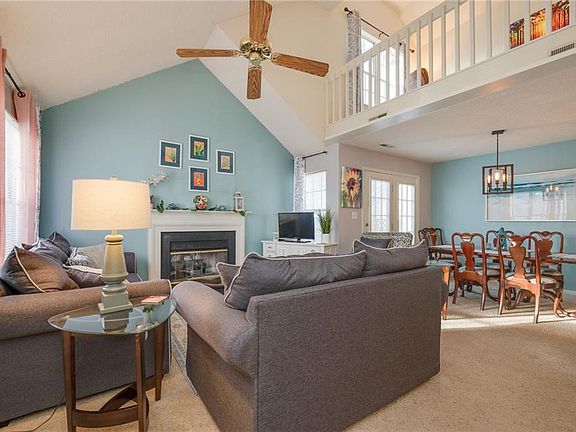 Open concept living with cathedral ceiling