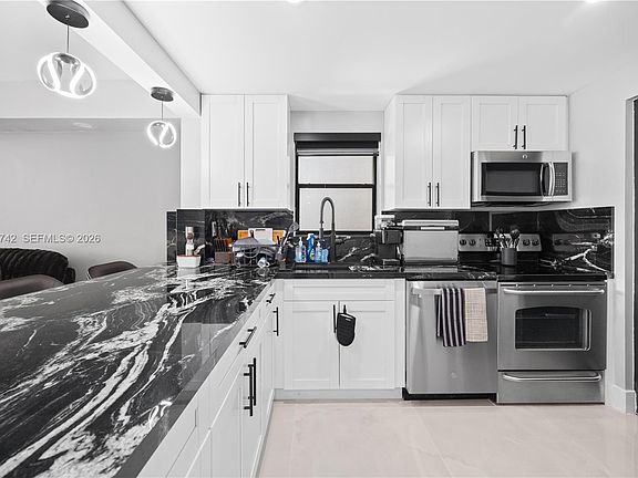 2nd image of 2302 S Cypress Bend Dr APT 306