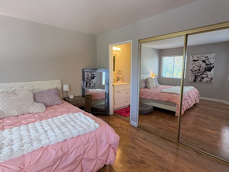 View from the Edge of the Master Bedroom with Mirrored Wardrobes
