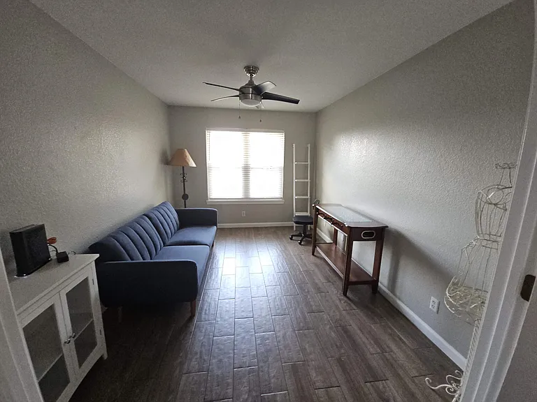 Bonus room with foosball table and futon couch.