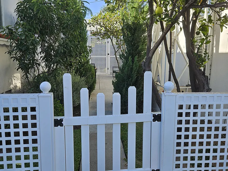 gated entry into shaded patio