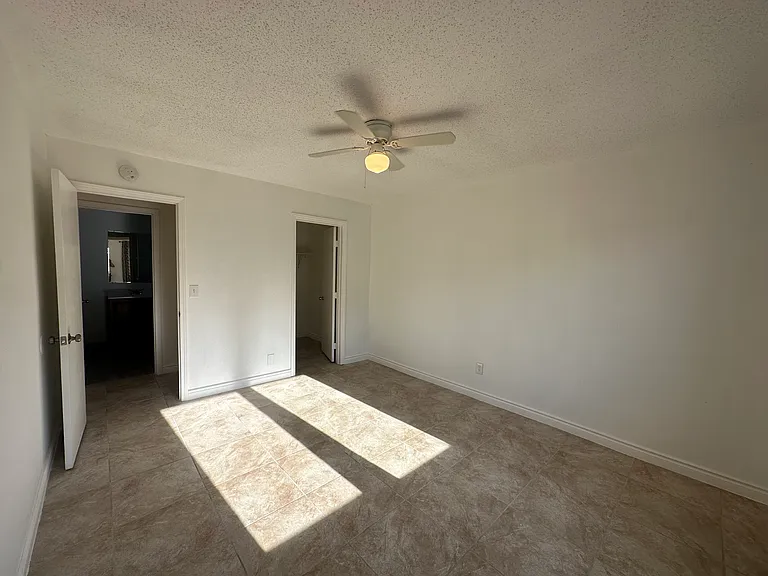 laege bedroom with walk in closet